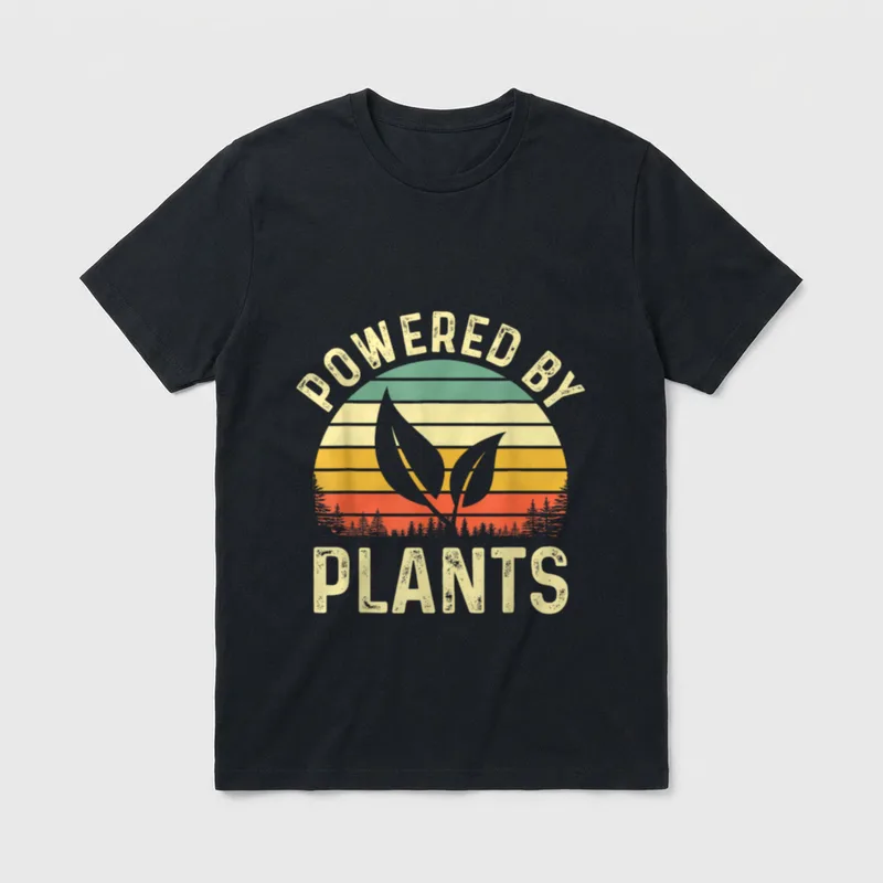 Vegan Plant Powered T-Shirt – "POWERED BY PLANTS" text with retro sunset and leaf design – Classic T-Shirt in Black