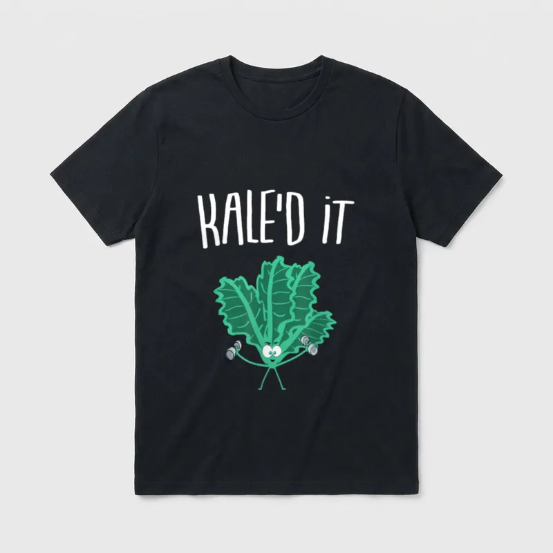 KALE'D IT Vegan Kale T-Shirt – Cartoon kale leaf lifting dumbbells under text KALE'D IT – Classic T-Shirt in Black