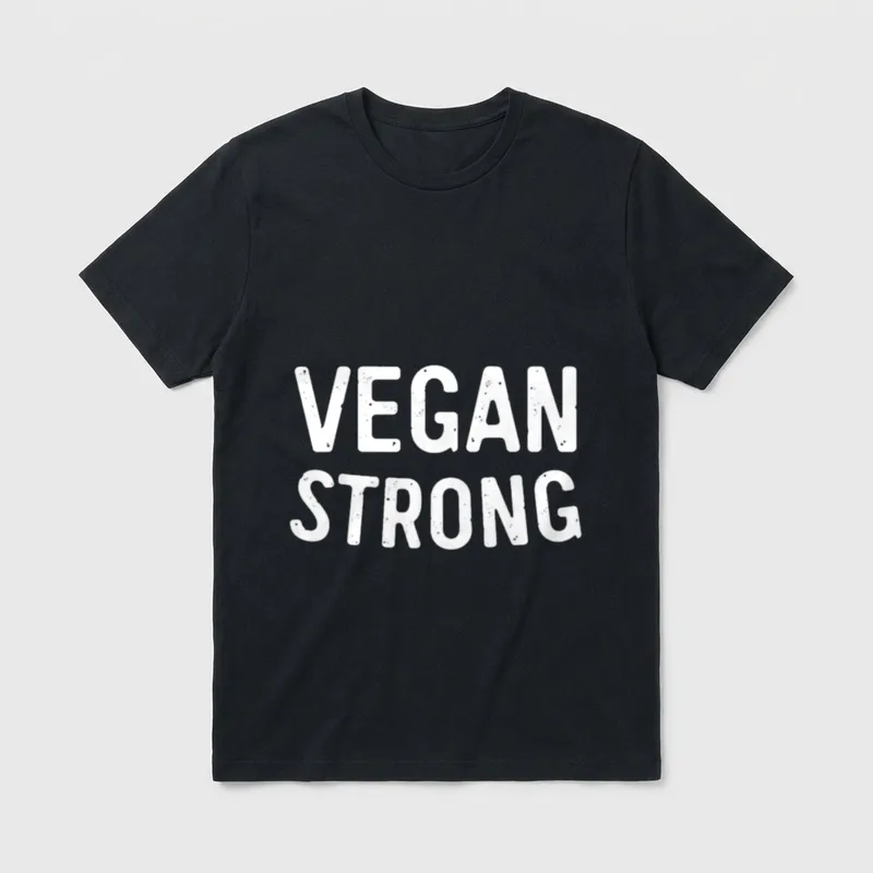 Vegan Strong Funny T-Shirt – White distressed text reading VEGAN STRONG on a grey background – Classic T-Shirt in Black