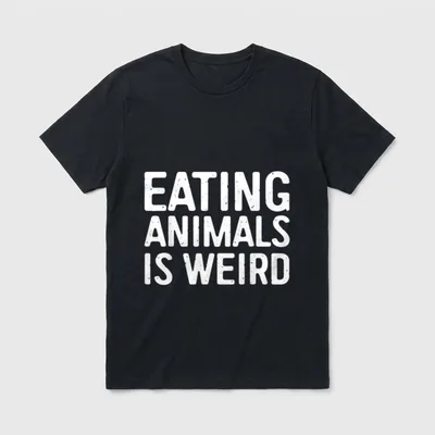 Eating Animals Is Weird T-Shirt – Bold white distressed letters spelling EATING ANIMALS IS WEIRD – Classic T-Shirt in Black