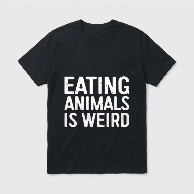 Eating Animals Is Weird T-Shirt – Bold white distressed letters spelling EATING ANIMALS IS WEIRD – Classic T-Shirt in Black