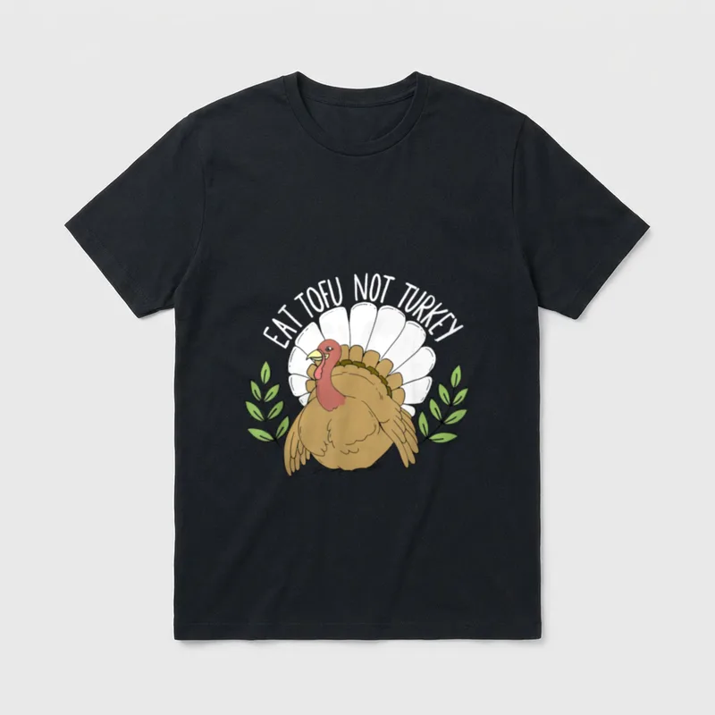 Eat tofu not turkey T-Shirt – Cartoon turkey with EAT TOFU NOT TURKEY text and green leaves – Classic T-Shirt in Black