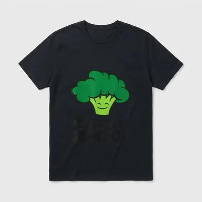 Powered By Broccoli Vegan T-Shirt – Smiling cartoon broccoli head with bold black text below – Classic T-Shirt in Black